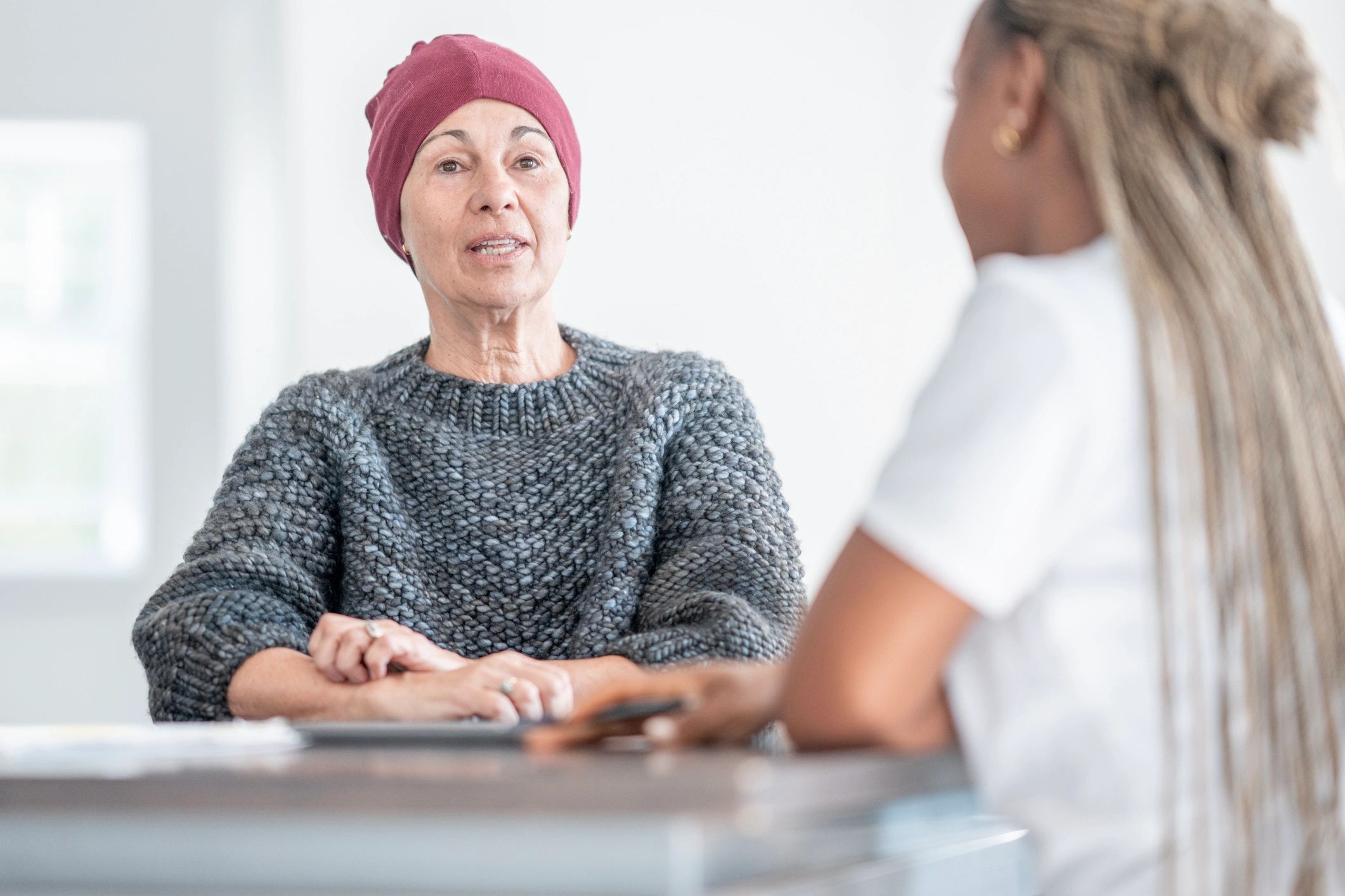 Supportive health conversation between a woman and her doctor